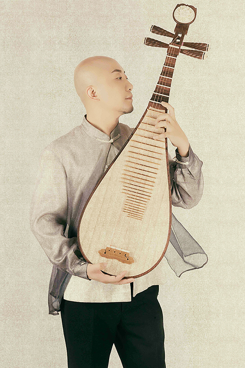 Artist and educator Jun Tian, professor at the School of Arts of the North University of China and a visiting artist at MTSU, poses with his pipa, a four-string, pear-shaped lute with its origins in ancient Persia and China, in this publicity photo. Tian will perform “Reflections: Clouds and Blossoms,” a concerto by award-winning contemporary composer Danhong Wang, with the MTSU Symphony Orchestra Saturday, Feb. 29, in a free public concert in the university's Wright Music Building. (photo submitted)