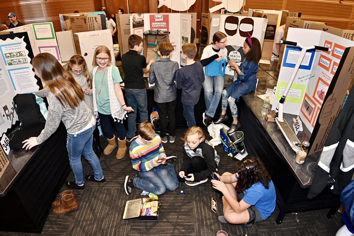A group of young Middle Tennessee inventors practice their presentations, discuss their inventions and have a snack while waiting to hear the judges' decisions at the 28th annual Invention Convention, held Feb. 27 at MTSU. Eight hundred twenty-eight fourth-, fifth- and sixth-grade students brought games and solutions to "make life easier" to present and demonstrate to judges for ribbons, trophies and plenty of praise. (MTSU photo by J. Intintoli)