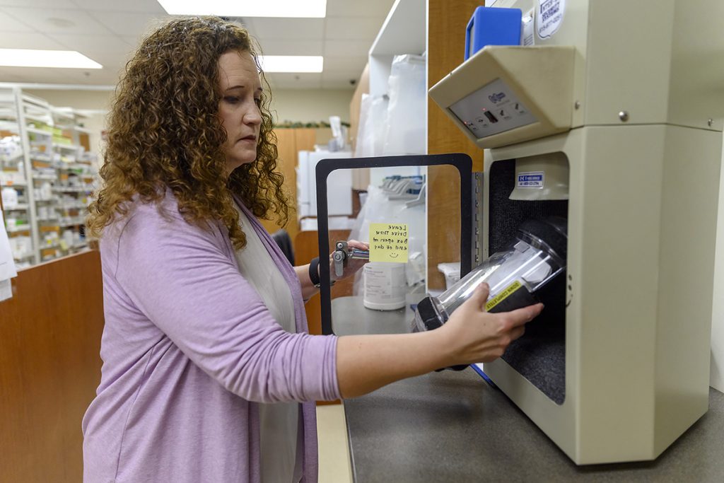 MTSU Pharmacist Tabby Ragland sends medications to a customer at the Campus Pharmacy drive-thru. The pharmacy and Student Health Services will be open Oct. 16-17 during fall break to serve students. The drive-thru is open until 4:30 p.m. both days. (MTSU file photo by J. Intintoli)