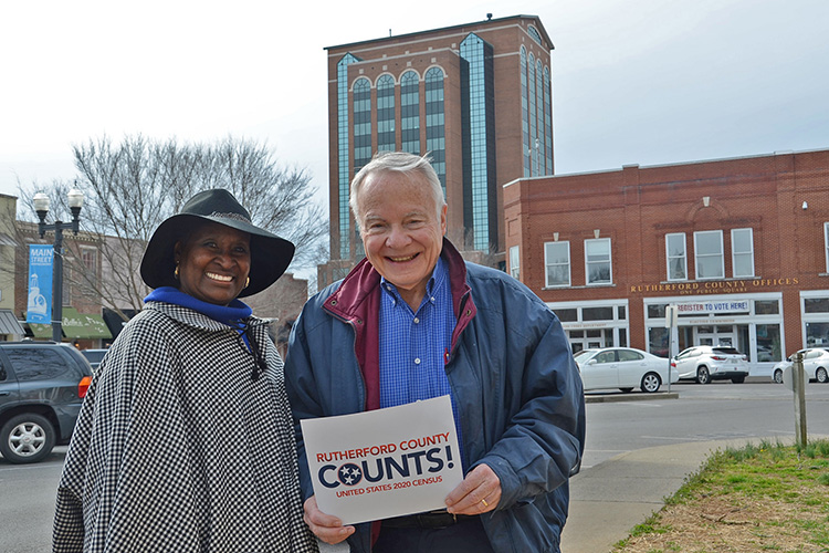 Gloria Bonner, left, and Bill Kraus, co-chairs of the volunteer Rutherford County Complete Count Committee for the 2020 Census, pose with a “Rutherford County Counts!” placard outside the Rutherford County Courthouse in downtown Murfreesboro, Tenn. Residents have started receiving via mail their invitation to fill out the 2020 Census questionnaire. (Submitted photo)