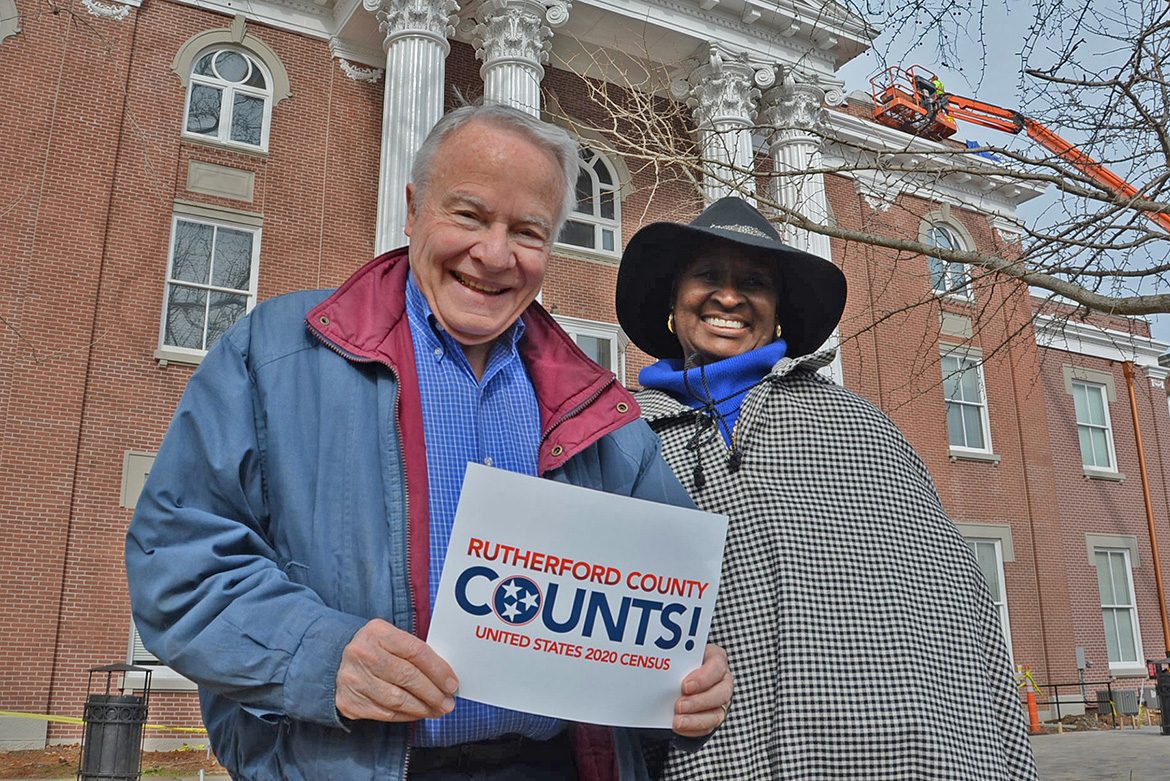 Bill Kraus, left, and Gloria Bonner, co-chairs of the volunteer Rutherford County Complete Count Committee for the 2020 Census, pose with a “Rutherford County Counts!” placard outside the Rutherford County Courthouse in downtown Murfreesboro, Tenn. Residents have started receiving via mail their invitation to fill out the 2020 Census questionnaire. (Submitted photo)