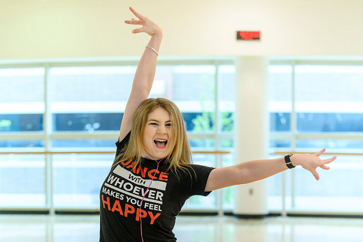 Cassidy Johnson strikes a dance pose in MTSU's campus recreation center