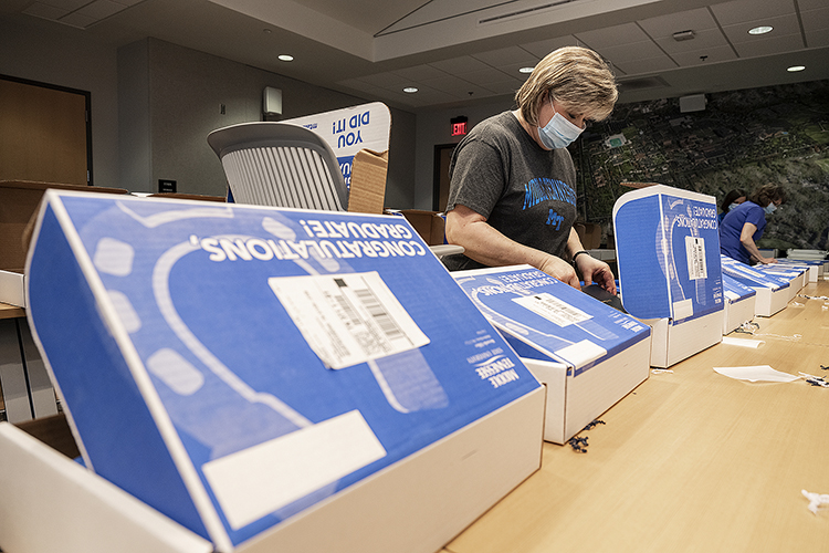 MTSU Associate Registrar Cindy Johnson places a diploma inside a True Blue Graduation Box for shipping to spring graduates Wednesday, May 20, inside the Student Services and Admissions Center. (MTSU photo by Andy Heidt)