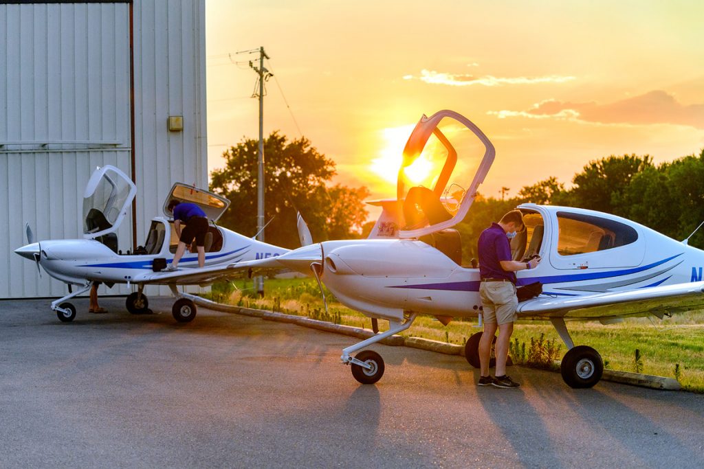 In this June 2020 file photo, MTSU aerospace students and certified flight instructors Ryan Patterson, partially hidden left, Cole Ferraro and Copher Kashif perform their final checks and unloading after flying in two new Diamond Aircraft to Murfreesboro Airport from Michigan near the Canadian border. MTSU is proposing to relocate its Aerospace campus to the Shelbyville Airport in nearby Bedford County to accommodate the exploding growth of its pilot training program. (MTSU file photo by J. Intintoli)