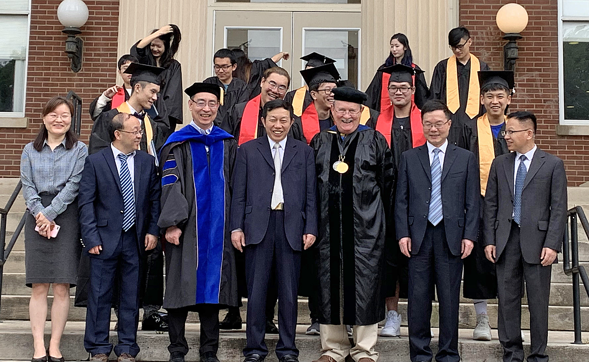 MTSU actuarial science students who graduated in May 2019 enjoy the moment with faculty and administrators outside Kirksey Old Main. The program continues to grow and received the 2020 Casualty Actuarial Society University Award. (Submitted photo)