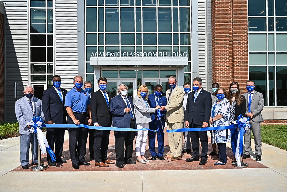 MTSU administrators and faculty cut the ribbon in front of the university’s new Academic Classroom Building Aug. 18. From left, J. D. Baker, MTSU Trustee; Darrell Freeman, vice chair, MTSU Board of Trustees; Bill Ketron, Rutherford County Mayor; Pete Delay, MTSU Trustee; Harold “Terry” Whiteside,” dean, College of Behavioral and Health Sciences; Pam Wright, MTSU Trustee; Sidney A. McPhee, MTSU president; Steven Smith, chair, MTSU Board of Trustees; Greg Schmidt, chair, Department of Psychology; Mark Byrnes, MTSU Provost; Cathy McElderry, chair, Department of Social Work; Mary Martin, MTSU Faculty Trustee; Delanie McDonald, MTSU Student Trustee; and Lee Wade, chair, Department of Criminal Justice. (MTSU photo by J. Intintoli)