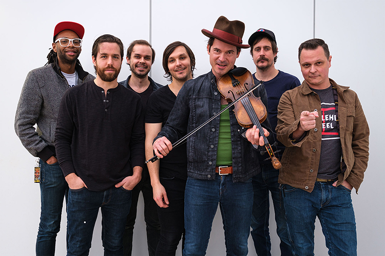 Members of the multi-Grammy-winning Americana string band Old Crow Medicine Show are shown in this 2019 publicity file photo. From left are Jerry Pentecost, Joe Andrews, Robert Price, Charlie Worsham (who is no longer with the band), Ketch Secor, Cory Younts and Morgan Jahnig. (Photo courtesy of Old Crow Medicine Show)