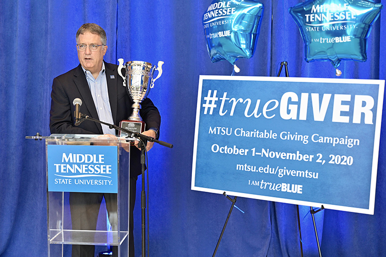 MTSU Provost Mark Byrnes holds the Provost Cup during the kickoff of the 2020-21 MTSU Employee Charitable Giving Campaign held recently in the atrium of the Cope Administration Building. The Provost Cup is a friendly competition between academic units that is awarded to the college with the highest percentage of employee participation. The Jones College of Business has won the cup for seven straight years. (MTSU photo by Andy Heidt)