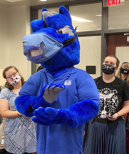 Students from the College of Behavioral and Health Sciences design team for Lightning’s masks fit one of their creations on the mascot. (MTSU photo by David Foster)