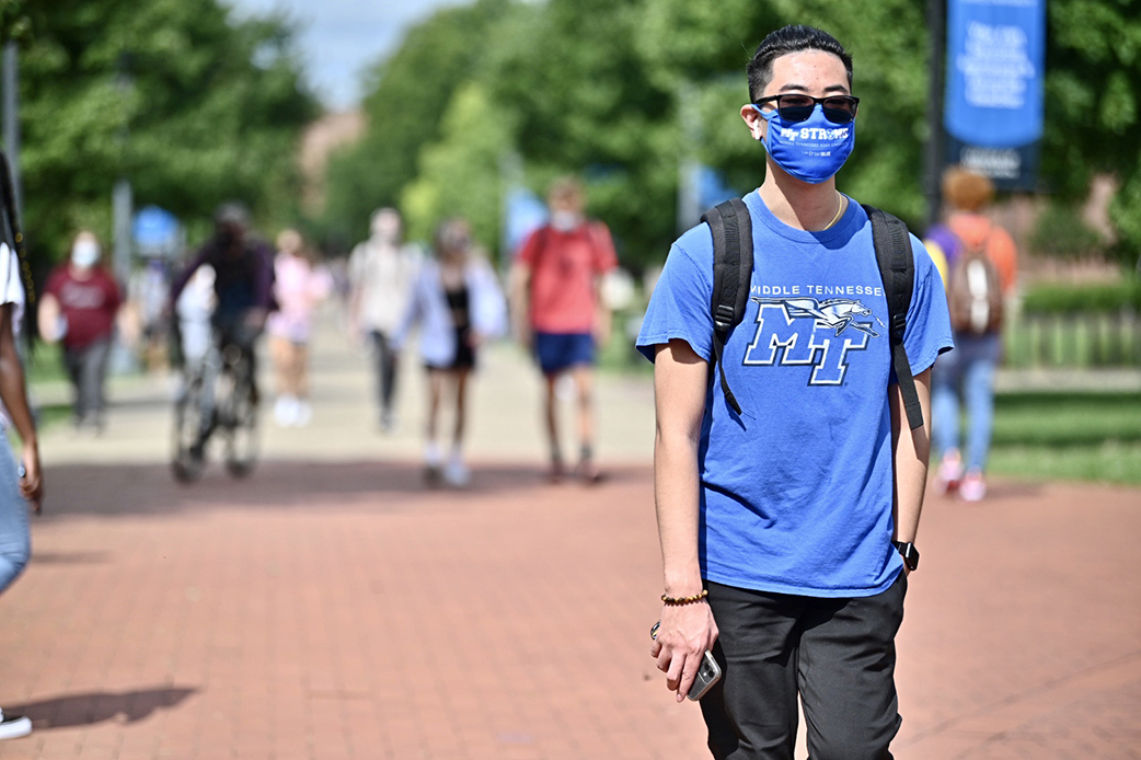 MTSU student Austin Southivong walks across campus during the first week of Fall 2020 classes. (MTSU photo by J. Intintoli)
