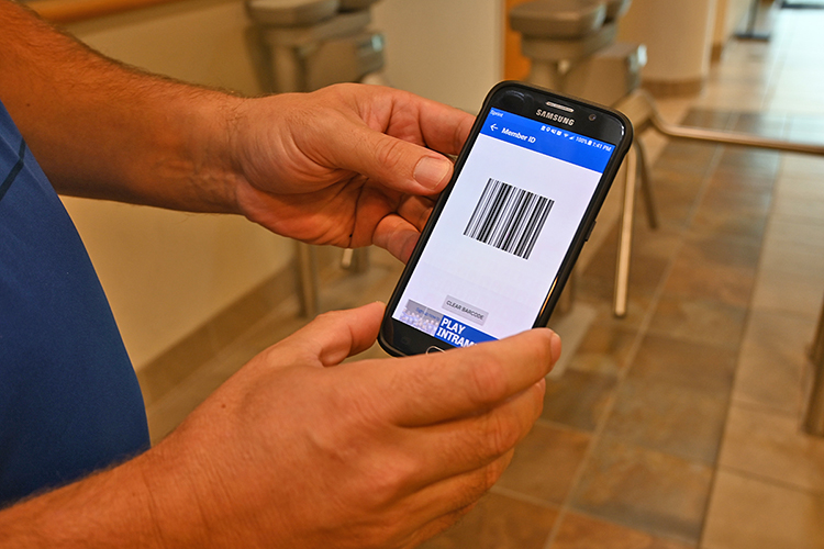 Andy Allgrim, campus recreation’s facility coordinator, shows off the scannable barcodes used for contactless entry at the rec center. (MTSU photo by Stephanie Barrette)