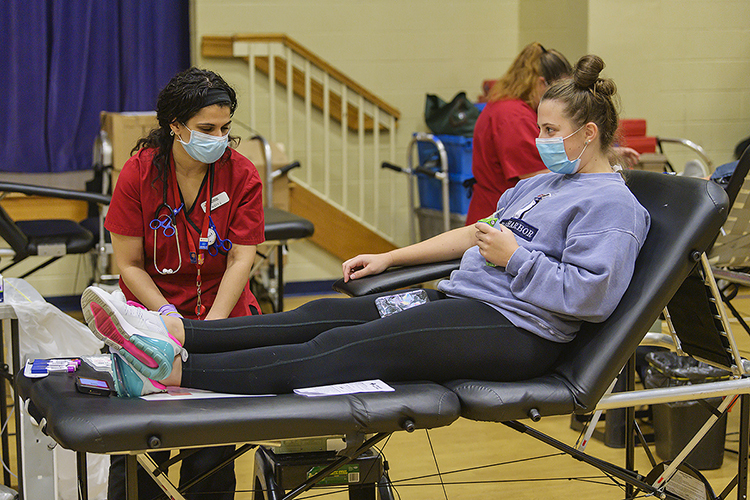 MTSU sophomore Taylor Shanklin, right, talks with American Red Cross nurse Nezzy Jaber as Shanklin prepares to donate blood at MTSU’s 2020 “Bleed Blue” blood drive last September in this file photo at the neighboring North Boulevard Church of Christ gymnasium. The MTSU Red Cross Club's annual valentine blood drive is set Monday, Feb. 8, at the same site. (MTSU file photo by Andy Heidt)