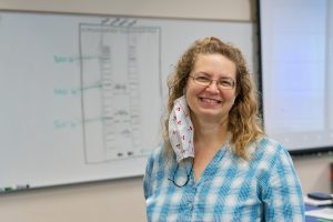 Rebecca Seipelt-Thiemann teaching her Honors Genetics class in the Science Building.