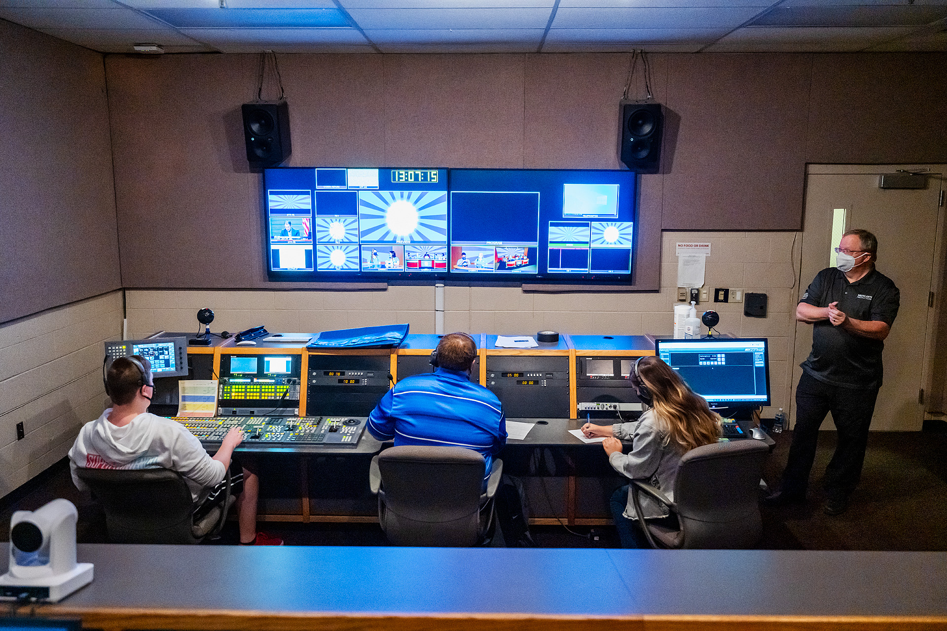 MTSU Department of Media Arts students produce one of six episodes of their game show "Don't @ Me" in Studio 1 of the Bragg Media and Entertainment Building as professor Robert "Bob" Gordon Jr., right, looks on. From left are students Walker Oakes, Ryan Tyler and Jordyn Lee and Gordon. (MTSU photo by Andy Heidt)