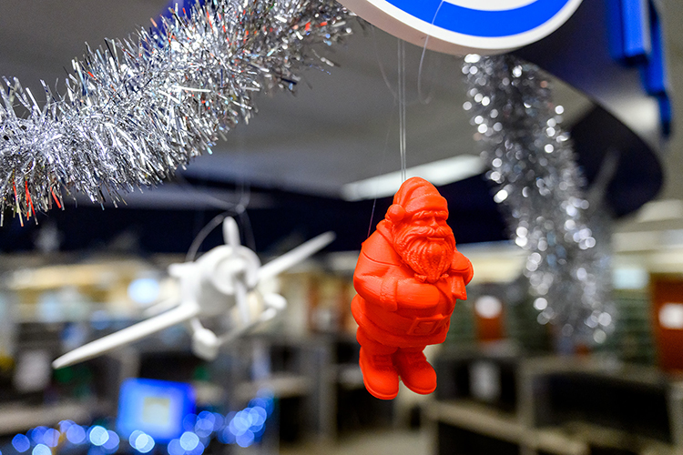 Santa Claus is watching over Makerspace in the James E. Walker Library to make sure COVID-19 protocols are observed. Many of the popular figurines that once adorned the help desk have been suspended from on high in order to prevent people from handling them. (MTSU Photo by J. Intintoli)