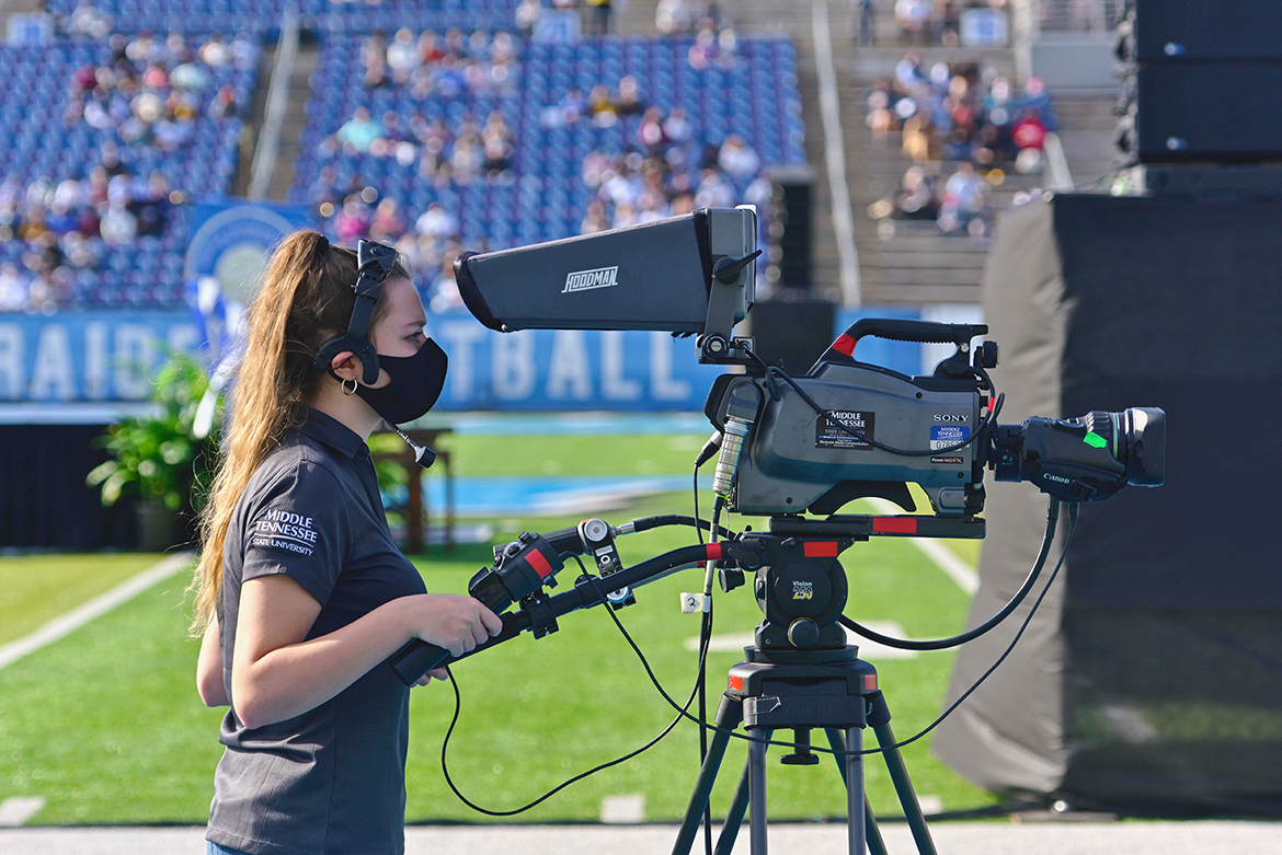 A student videographer captures live coverage of one of the three Fall 2020 commencement ceremonies held Nov. 21 at Floyd Stadium. Students from the College of Media and Entertainment’s Department of Media Arts, as well as students working for the university’s Production Services team, produced True Blue TV’s coverage. The three ceremonies will re-air for 24 hours on Saturday, Nov. 28, on True Blue TV. (MTSU photo)