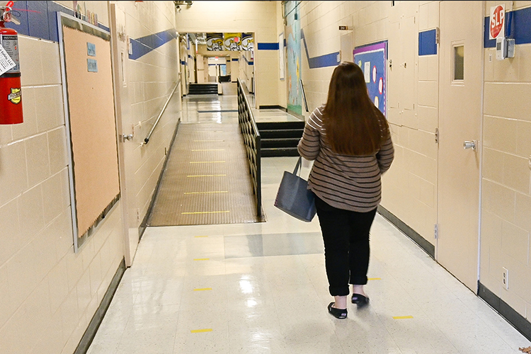 Elizabeth Smith, an MTSU teacher candidate student, walks the empty halls of Thurman Francis Arts Academy while completing her semester of student teaching during COVID in Smyrna, Tenn., on Oct. 14, 2020. (MTSU photo by Stephanie Barrette)