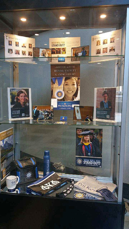 Phi Kappa Phi regalia and paraphernalia decorate a display case on the first floor of the James E. Walker Library. The display highlights the organization’s dedication to the love of learning and public service. (Photo submitted)