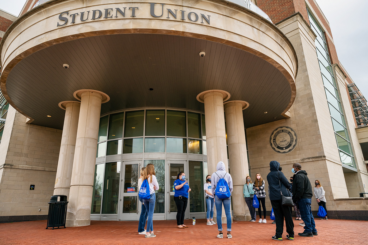 An early stops for the daily campus tours is a visit to the Student Union. Student guides Miura Rempis, left front center, and Ashley Conser lead this recent in-person tour for the Admissions Office. Tours are offered four times a day throughout the week, plus some Saturdays, and masks and social distancing are part of the COVID-19 safety protocols. (MTSU photo by Andy Heidt)