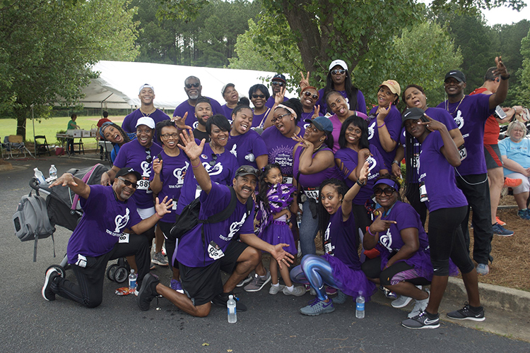 This undated photo shows members of the ToyaTuff Foundation at the nonprofit’s most recent 5K race. The foundation raises money for special needs children and their families and was founded in memory of Toya Stegall, the late daughter of MTSU alumnus Ed Stegall, kneeling center left, and wife Barbara, standing behind him. (Submitted photo)