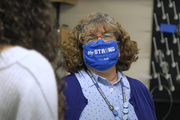 Mary Farone, Middle Tennessee State University biology professor, talks with one of her undergraduate research students who collaborates on a project investigating bacteria and food safety on campus in November 2020. (MTSU video screen grab)