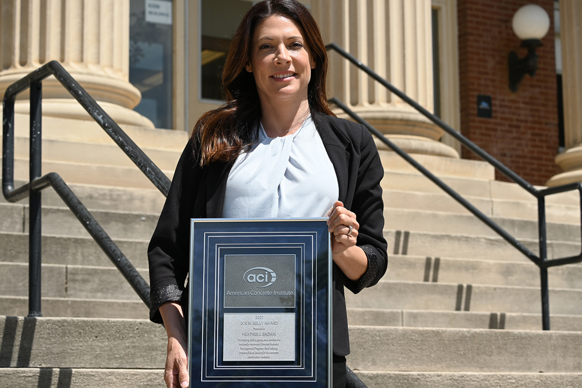 MTSU professor Heather Brown holds the American Concrete Institute’s 2021 Joe W. Kelly Award she recently received. “The Joe W. Kelly Award encompasses the love I have for education. Receiving the award has been a milestone for me already this year. To be recognized by the American Concrete Institute as an exemplary educator just really caps the career I’ve had so far,” she said. (MTSU photo by Jimmy Hart)