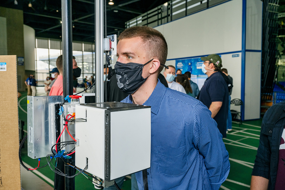 Daniel Reissner, MTSU senior mechatronics engineering major, checks the reliability of the Automated Temperature Tester Thursday, April 29, at the annual MTSU Mech Tech Expo featuring Engineering Technology students and their senior projects and posters on the track level of Murphy Center. (MTSU photo by Andy Heidt)