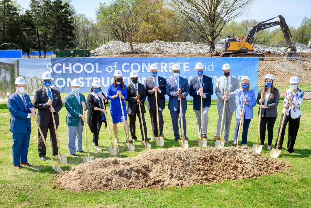 MTSU officials celebrated the groundbreaking ceremony for the 54,000-square-foot, $40.1 million School of Concrete and Construction Management Building on the southeast side of campus in early April. Ceremonial shoveling of dirt participants included, from left, Pete DeLay, trustee; Tom Boyd, trustee; J.B. Baker, trustee; Mary Martin, faculty trustee; Heather Brown, former professor and director of the School of Concrete Industry Management; MTSU President Sidney A. McPhee; Stephen Smith, Board of Trustees chairman; Darrell Freeman, trustee vice chairman; Kelly Strong, director, MTSU School of Concrete and Construction Management; Daniel Bugbee, CIM (Concrete Industry Management) Patrons president; Pam Wright, trustee; Delanie McDonald, student trustee; and Christine Karbowiak Vanek, trustee. The building is scheduled to open in August 2022. (MTSU photo by J. Intintoli)