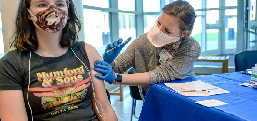 MTSU student Megan Young, left, receives the COVID-19 vaccine from Abby Sparkman of Murfreesboro, a fourth-year Lipscomb University pharmacy student, in the Health, Wellness and Recreation Center. Next week, April 12-16, MTSU students can be vaccinated — by appointment only — in the Student Union Building’s first-floor lobby. (MTSU photo by J. Intintoli)
