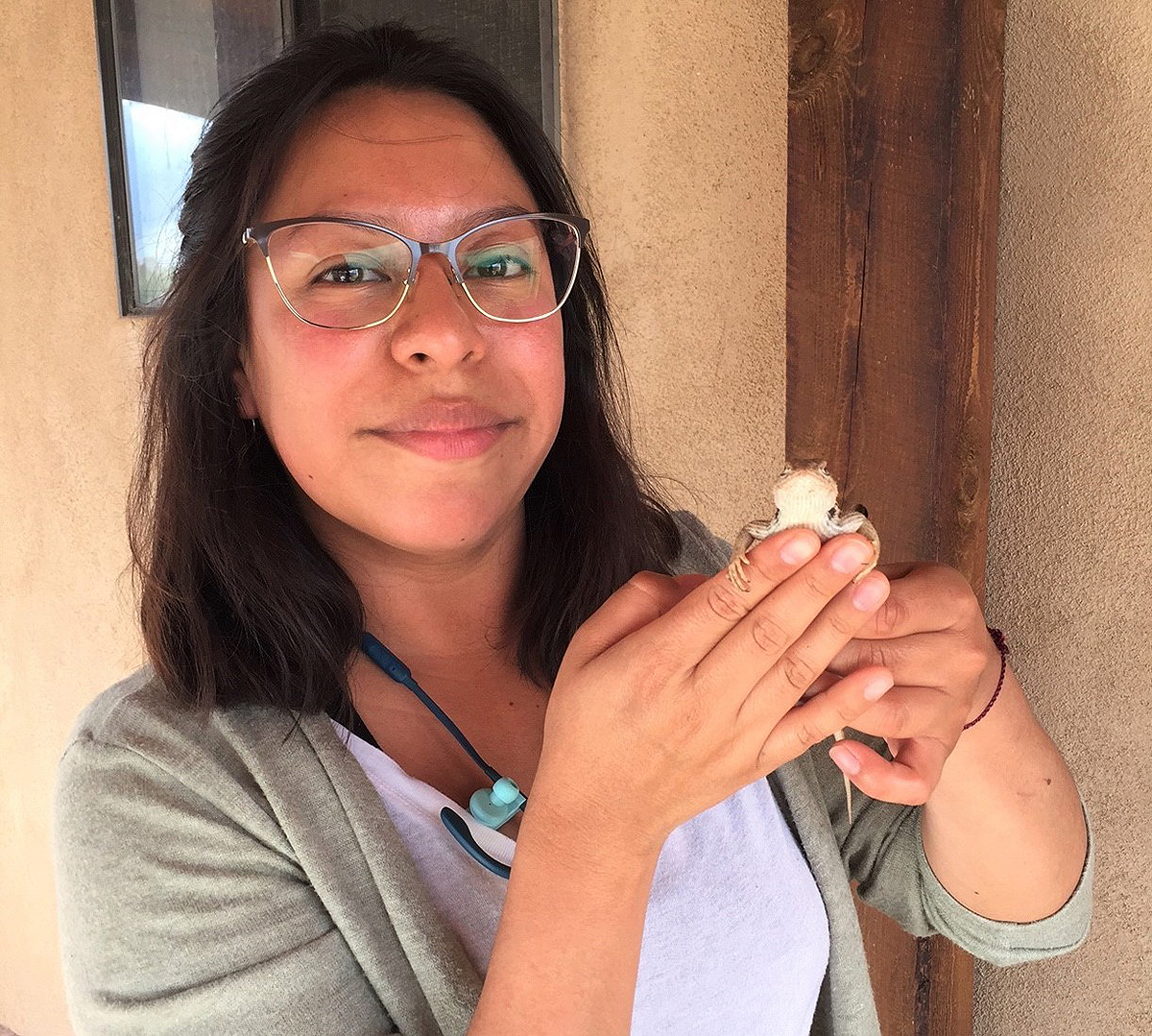 MTSU senior biology major Denise Ortega of Madison, Tenn., holds a lizard she was studying in 2019 while on a National Science Foundation research trip to New Mexico. Ortega has received a 2021 Goldwater Scholarship. She plans to graduate in December. (Submitted photo by Vera Ting)