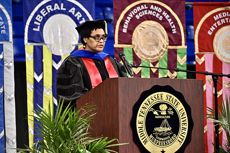 Dr. Barbara Turnage, associate dean of MTSU’s College of Behavioral and Health Sciences, pauses to look up at her college's Class of 2021 while speaking to them Friday, May 7, inside Murphy Center during the first day of the university's spring 2021 commencement ceremonies. Students returned to Murphy Center May 7-9 for the first time since 2019 for a three-day, 10-event, socially distanced commencement weekend. (MTSU photo by J. Intintoli)