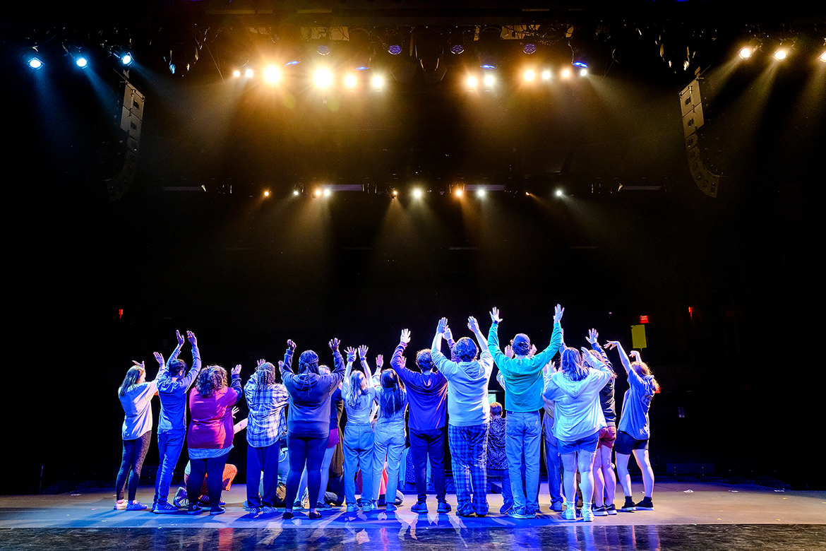 Young theater students attending the 2021 Governor's School for the Arts at MTSU raise their arms and shout in celebration during a June 23 rehearsal on the university's Tucker Theatre stage. Nearly 300 11th and 12th graders from across Tennessee attended the monthlong residency program in person for intensive training in music, theater, visual arts, dance and filmmaking. (MTSU photo by J. Intintoli)