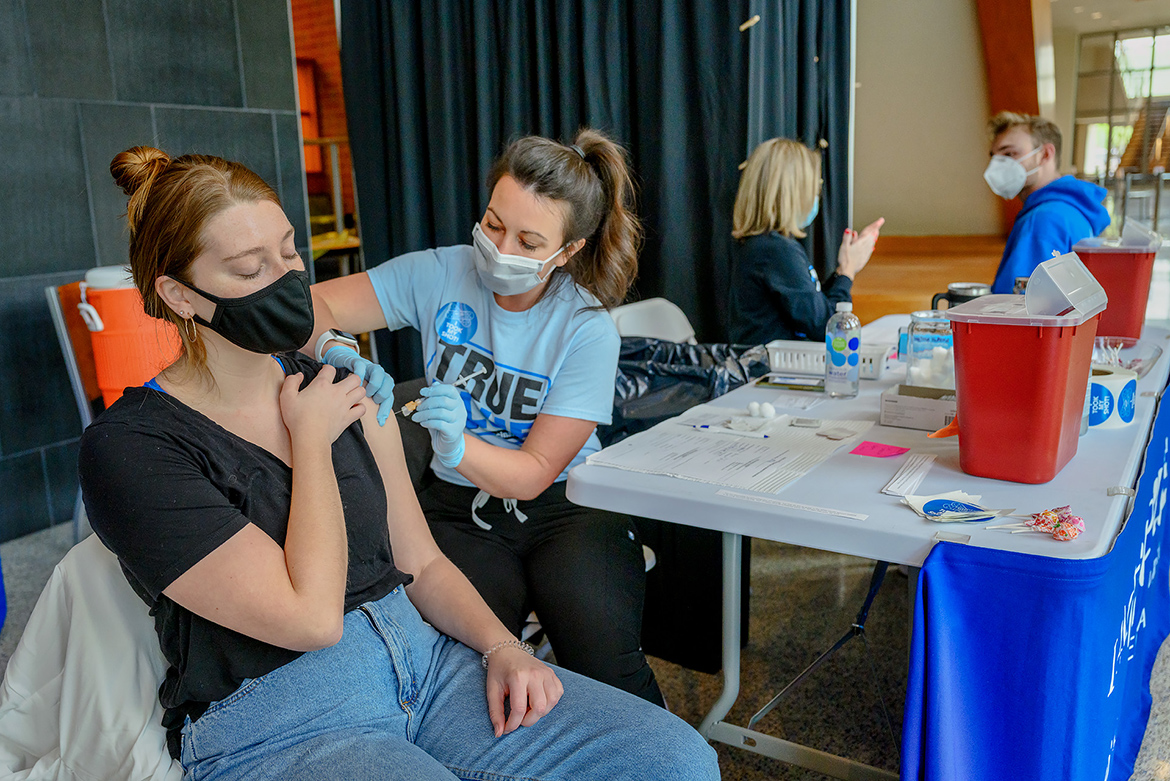 In this April file photo, MTSU student Julia Hagelberg receives her vaccination from physician assistant Ashley Bjork during a special clinic inside the Student Union building. MTSU Student Health Services continues offering clinics this summer during CUSTOMS new student orientation sessions. (MTSU file photo by J. Intintoli)