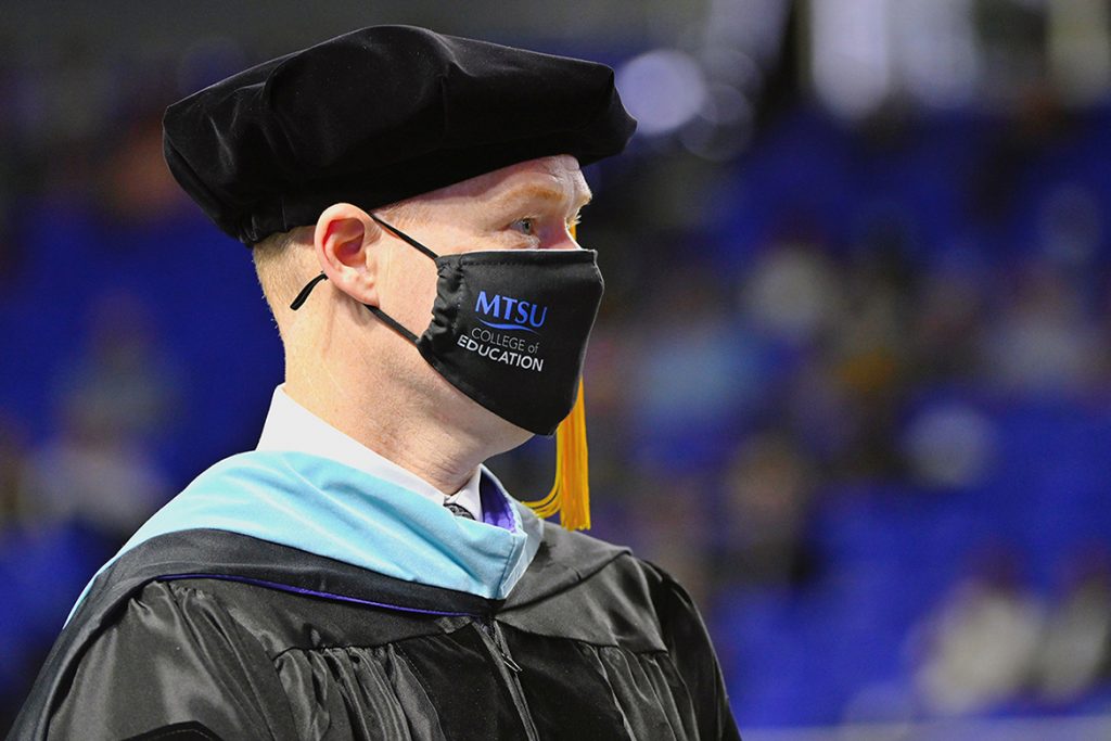 Murfreesboro City Schools Director Trey Duke prepares to accept his degree during MTSU’s Spring Commencement held May 8, 2021, inside Murphy Center. Duke graduated with his third degree from Middle Tennessee State University, a doctorate in K-12 assessment, learning and student success. (MTSU photo by Stephanie Barrette)