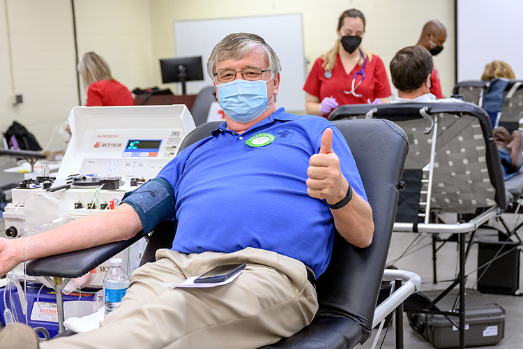 Tom Wallace, MTSU associate vice-president for information technology, gives a thumbs-up while waiting to donate a pint of blood at the university's annual “Battle of the Branches” blood drive Sept. 2 in the Keathley University Center. Donors from across the campus and surrounding community gave 80 pints of blood to help as many as 225 people across the region and state. (MTSU photo by J. Intintoli)