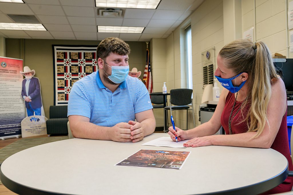 MTSU student Will Johnson, left, of Martin, Tenn., learns more about the upcoming “Newcomers Briefing” for student veterans and their families from Elizabeth Wilburn, office manager in the Charlie and Hazel Daniels Veterans and Military Family Center. The event will be held starting at 5 p.m. Thursday, Aug. 18, in the Tom H. Jackson Building’s Cantrell Hall on campus. (MTSU file photo by Andy Heidt)