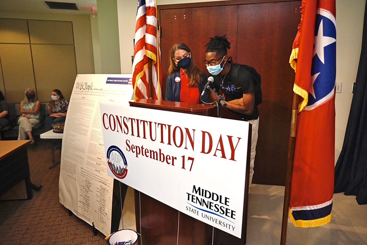 Dr. Mary Evins, a research professor of history and coordinator of the American Democracy Project at MTSU, assists a student in reading a section of the U.S. Constitution Sept. 15 in the Paul W. Martin University Honors Building. Students read sections of the founding document at six venues Sept. 14-16 to help celebrate Constitution Week. (MTSU photo by J. Intintoli)