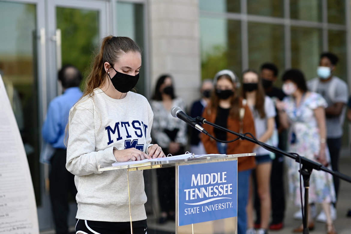 A student reads a section of the U.S. Constitution outside the MTSU Science Building Sept. 14 as part of the university's celebration of Constitution Week. (MTSU photo by J. Intintoli)