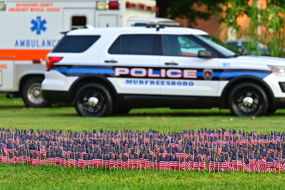 Along with a field of U.S. flags representing the 2,977 casualties from the 9/11 attacks on Sept. 11, 2001, static displays of first responder vehicles (Murfreesboro City Police and Fire and Rutherford County EMS) were part of the 7th 9/11 Remembrance Saturday, Sept. 11, near the MTSU Veterans Memorial. (MTSU photo by Cat Curtis Murphy)