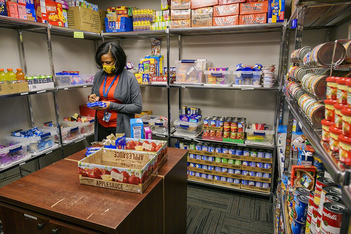 Danielle Rochelle, coordinator of outreach and support programs, checks the inventory in the MTSU Student Food Pantry in the MT One Stop. (MTSU photo by Andy Heidt)
