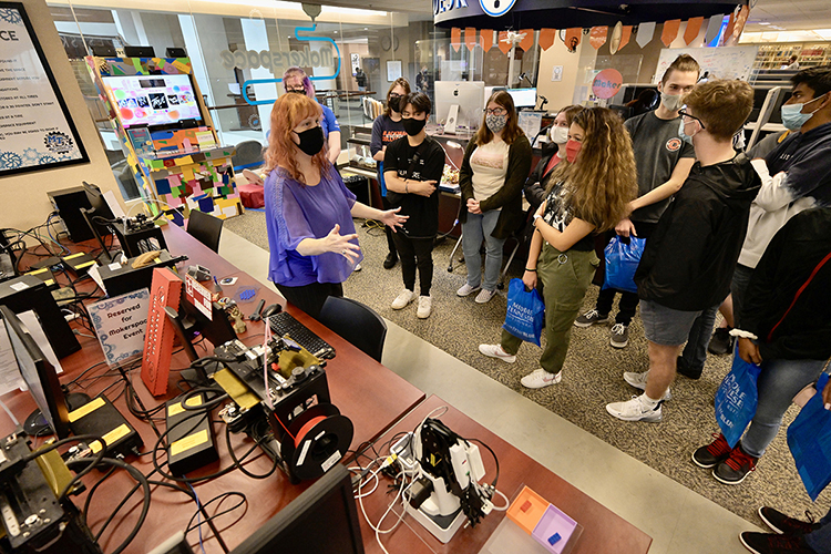 Valerie Hackworth, assistant manager of technology services at the James E. Walker Library, introduces students from Blackman Collegiate Academy to 3D printing at the library's Makerspace during BCA's Oct. 21 visit to MTSU. (MTSU photo by Andy Heidt)