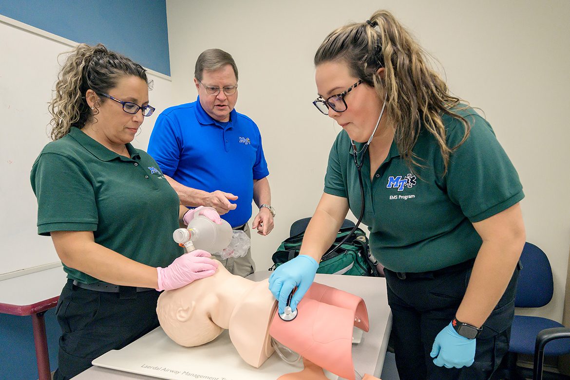 Instructor Randy White gives guidance to students Chrissy Worrell, left, and Galelyn VanMeter in an Advanced EMT Class in the Miller Education Center on Bell Street. (MTSU photo by Andy Heidt)