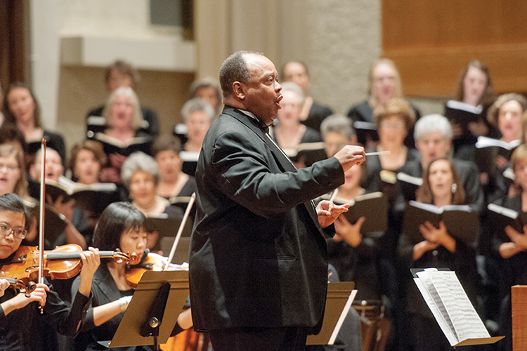 This file image shows MTSU School of Music professor Raphael Bundage, center, conducting the MTSU Schola Cantorum and Middle Tennessee Choral Society in concert at Hinton Music Hall in the Wright Music Building on campus. (MTSU file photo by J. Intintoli)