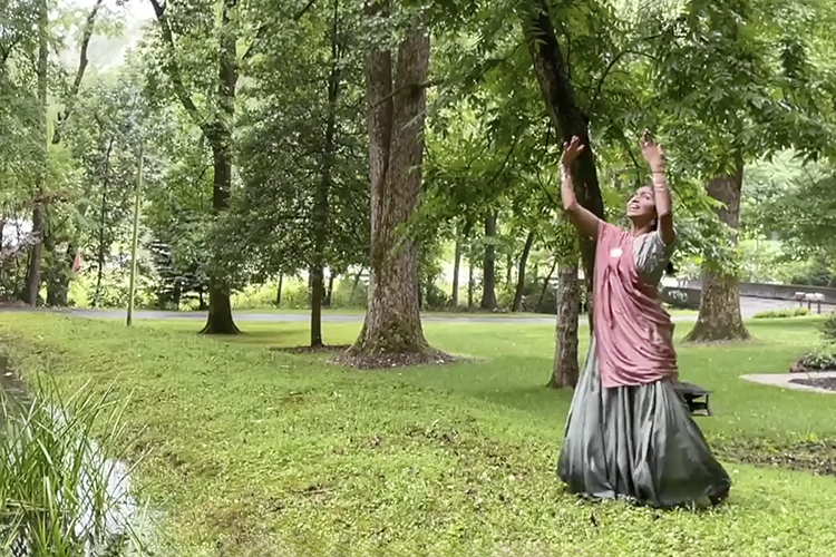 Instructor Nanthana "Tanamayi" Vaiyapuri performs her Bollywood “Rain Dance” outdoors in a gentle rain in this screen shot from the first in a series of six instructional videos offered by the Center for Accelerated Language Acquisition at MTSU. (image courtesy of Tanamayi Vaiyapuri)