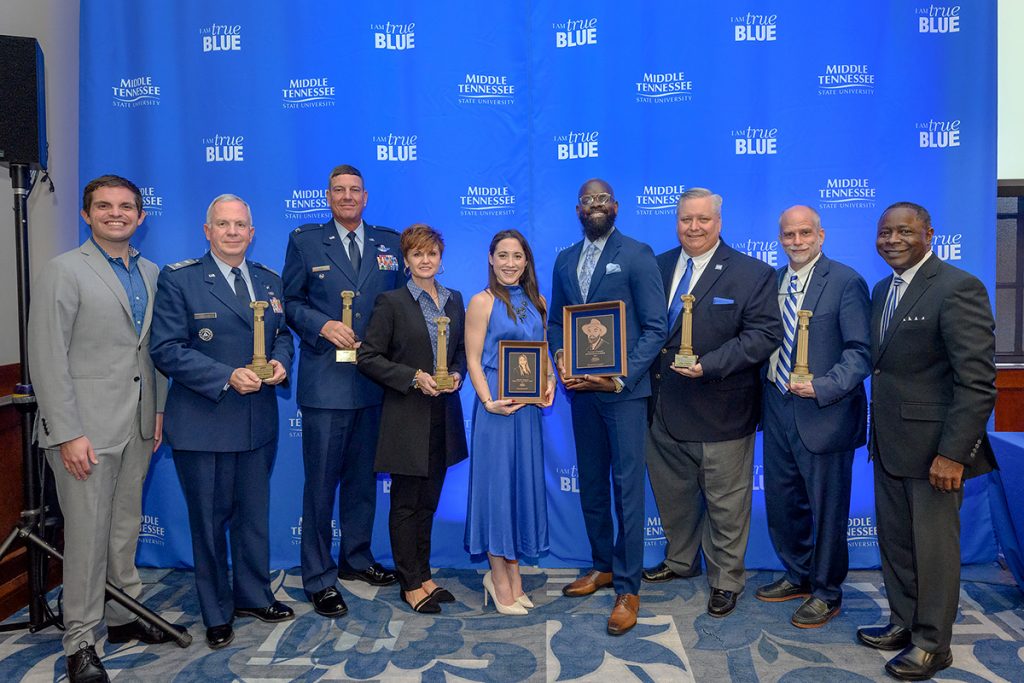 The 2021-22 MTSU Distinguished Alumni were recognized during Homecoming Weekend. The group includes Matthew Hibdon, left, National Alumni Association Board president; Civil Air Patrol Col. Barry Melton; U.S. Air Force Col. Joel Cook; MTSU professor Rebecca Foote; Gabrielle Thompson; Torrance Esmond; Chip Walters; Mitch Miller and MTSU President Sidney A. McPhee. Thompson is the Young Alumni recipient, Esmond is the Distinguished Alumnus and the others received Citations of Distinction recognition. (MTSU photo by J. Intintoli)