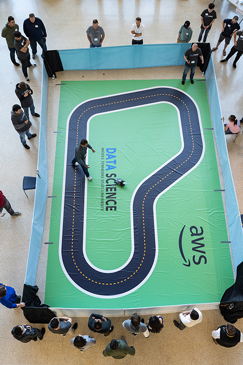 An overhead view shows the race track used at the Nov. 13 “AWS DeepRacer” event held in the MTSU Science Building Atrium. The event, which featured five teams racing autonomous racing models, was sponsored by the MTSU Data Science Institute and Amazon Web Services. (MTSU photo by Cat Curtis Murphy)
