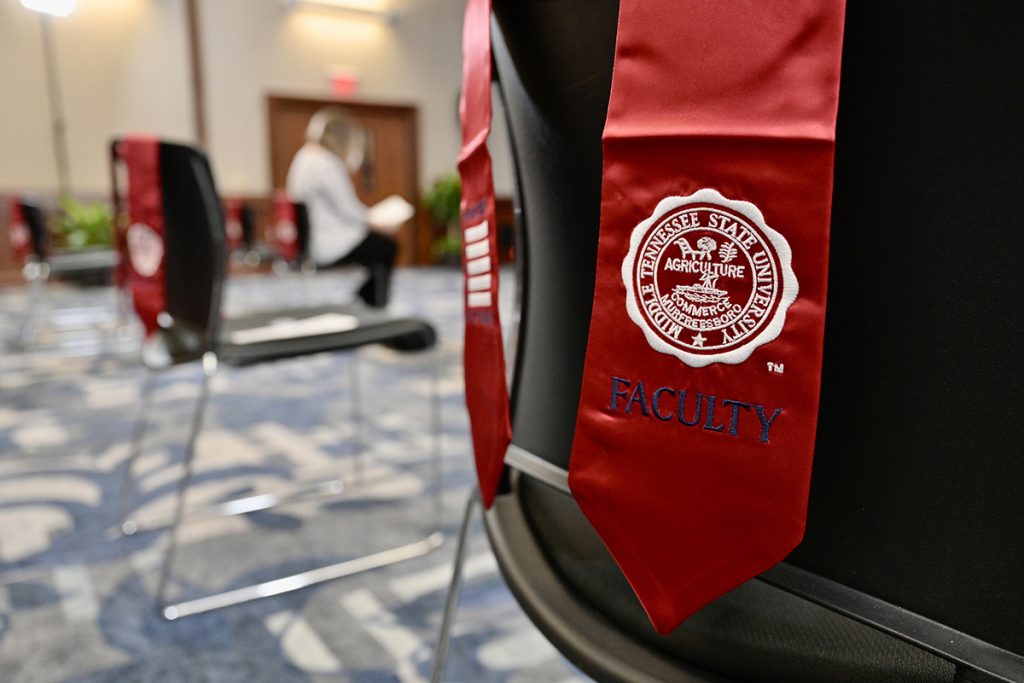 A red stole rests on the back of a chair in the Sam H. Ingram Building’s MT Center before the annual MTSU Faculty-Staff Veterans Stole Ceremony Wednesday, Nov. 10. The stoles were given to MTSU faculty and staff who served or continue to serve in any U.S. military branches. They can be worn during any future MTSU commencement ceremonies. (MTSU photo by Andy Heidt)