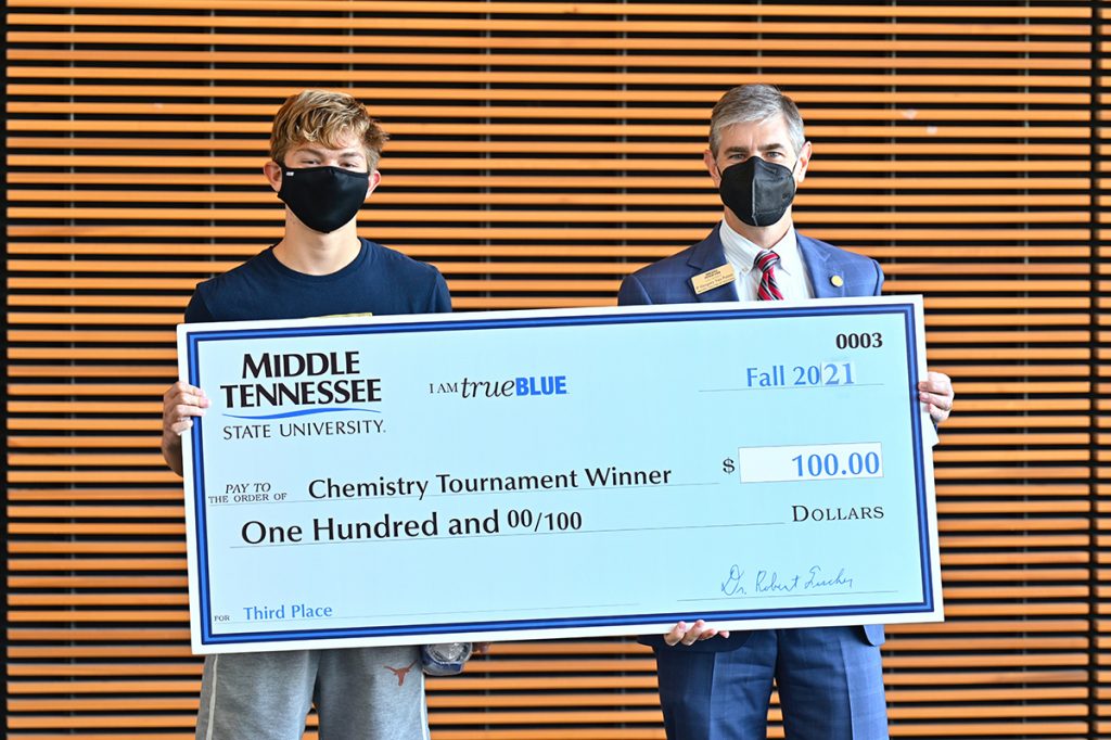 MTSU Department of Chemistry Chair Greg Van Patten, right, awarded Nathaniel Martinez a $100 cash prize for being the top junior winner in the 2021 Chemistry Scholarship Tournament, held in the Science Building on campus. Lozano is a student at Independence High School in Thompson’s Station, Tenn. (MTSU photo by Cat Curtis Murphy)