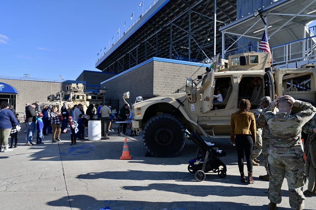 MTSU football and military fans of all ages check out the Tennessee National Guard tanks on display outside Floyd Stadium Saturday, Nov. 13, during MTSU Salute to Veterans and Armed Forces activities. MTSU Athletics and the Charlie and Hazel Daniels Veteran and Military Family Center organize numerous events and provide free game tickets and barbecue picnic for veterans and current service members. (MTSU photo by Andy Heidt)