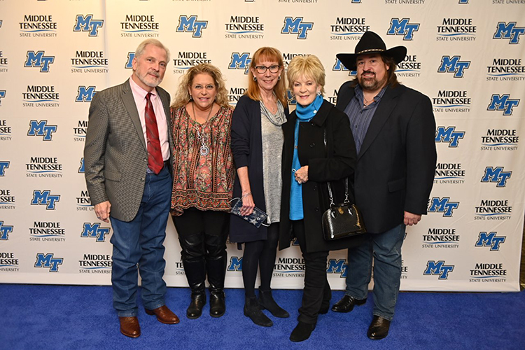 Hazel Daniels, second from right, widow of country music legend Charlie Daniels, and their son, Charlie Jr., far right, pose with fellow attendees Tuesday, Nov. 2, at the fourth annual Veteran Impact Celebration held at the Student Union Ballroom at Middle Tennessee State University. Proceeds from the event benefit MTSU’s Charlie and Hazel Daniels Veterans and Military Family Center. (MTSU photo by James Cessna)
